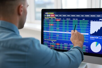 Financial trading specialist working with data in office, selective focus