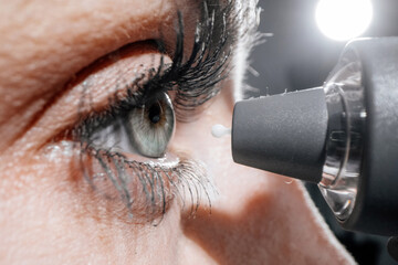 A device for measuring intraocular pressure. Close-up of the eye during diagnosis. The concept of...