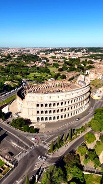Roman Colosseum drone view. Flavius Amphitheater is an architectural monument of Ancient Rome, an aerial view. Rome, Italy. The architecture of ancient Rome. Vertical video.