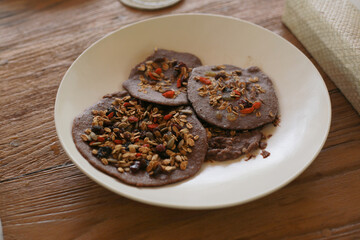 Brown Pancakes with Oat Muesli on White Plate
