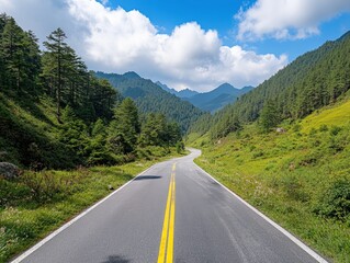 Fototapeta premium Winding road through serene mountainous forest landscape