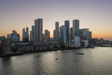 An low level aerial image of Canary Wharf at sunset