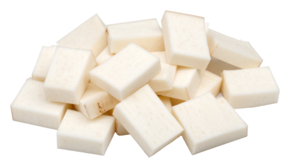 Close up view revealing white, peeled arrowroot tubers cut into precise cubes, sitting cleanly against transparent surface