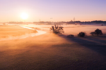 Sunrise over foggy riverbank. High quality photo