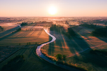Sunrise over river on misty morning. High quality photo
