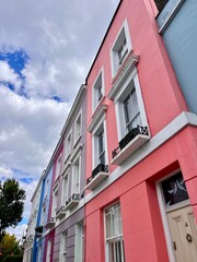 Obraz premium Pastel coloured buildings in Kentish Town near Hampstead, London, England, United Kingdom, Europe. An aesthetic photo capturing iconic European / English architecture in the heart of London City.