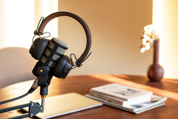 Engaging podcast recording setup with microphone and headphones in cozy workspace