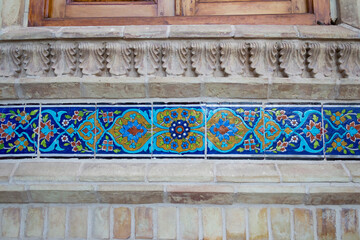 Zoroastrian fire temple adorned with intricate tile work, showcasing vibrant floral patterns and traditional Persian craftsmanship in Yazd, Iran