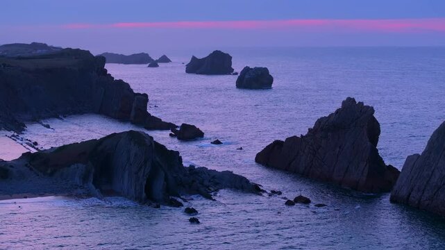 Aerial view of the sunset lights on the cliffs of Los Urros de Liencres in the Dunes of Liencres Natural Park. Pi&eacute;lagos Municipality, Costa Quebrada Geopark, Cantabrian Sea, Cantabria, Spain, Europe