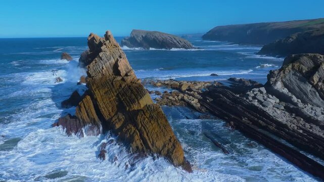 Waves on the cliffs of Madero Beach in the Dunes of Liencres Natural Park. Liencres, Pi&eacute;lagos Municipality, Costa Quebrada Geopark, Cantabrian Sea, Cantabria, Spain, Europe