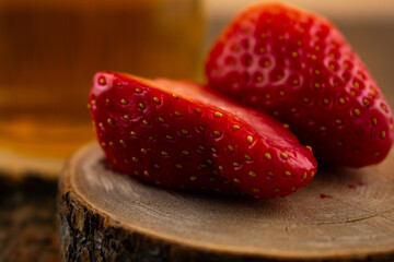 inviting close-up features a glass of green tea alongside vibrant strawberries, evoking a sense of...