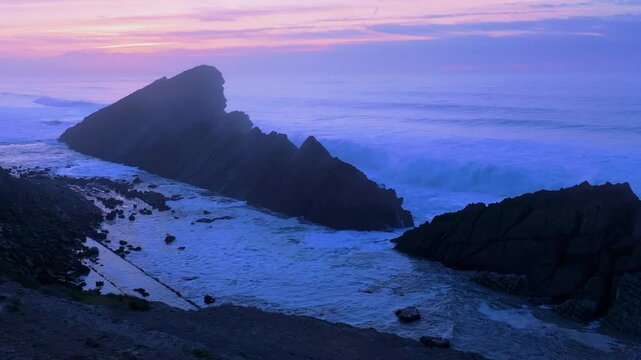Aerial view of the sunset lights on the cliffs of Madero Beach in the Dunes of Liencres Natural Park. Pi&eacute;lagos Municipality, Costa Quebrada Geopark, Cantabrian Sea, Cantabria, Spain, Europe