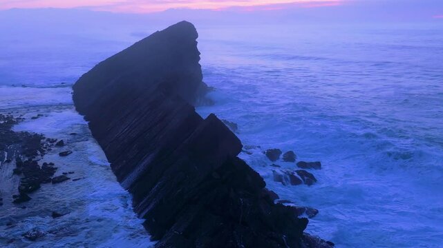 Aerial view of the sunset lights on the cliffs of Madero Beach in the Dunes of Liencres Natural Park. Pi&eacute;lagos Municipality, Costa Quebrada Geopark, Cantabrian Sea, Cantabria, Spain, Europe