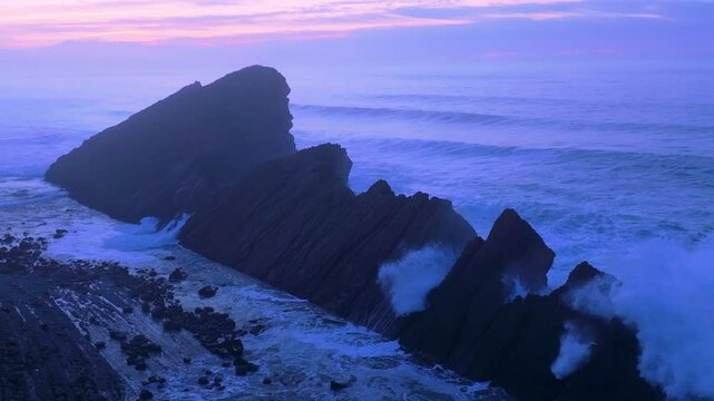 Aerial view of the sunset lights on the cliffs of Madero Beach in the Dunes of Liencres Natural Park. Pi&eacute;lagos Municipality, Costa Quebrada Geopark, Cantabrian Sea, Cantabria, Spain, Europe