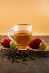 a glass of green tea, fresh strawberries, and juicy grapes, evoking a feeling of healthy indulgence and pure wellness. Ideal for clean eating, healthy recipes, or mindful lifestyle content