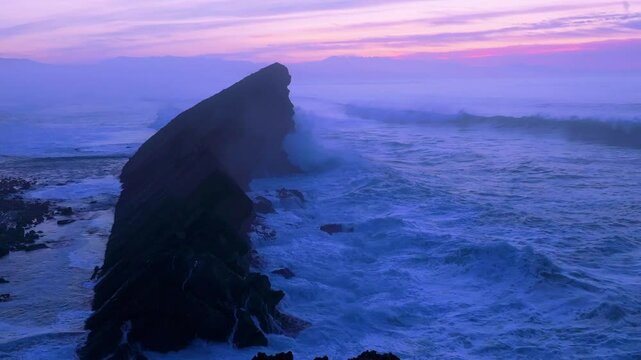 Aerial view of the sunset lights on the cliffs of Madero Beach in the Dunes of Liencres Natural Park. Pi&eacute;lagos Municipality, Costa Quebrada Geopark, Cantabrian Sea, Cantabria, Spain, Europe