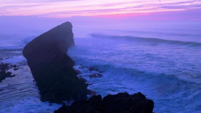 Aerial view of the sunset lights on the cliffs of Madero Beach in the Dunes of Liencres Natural Park. Pi&eacute;lagos Municipality, Costa Quebrada Geopark, Cantabrian Sea, Cantabria, Spain, Europe