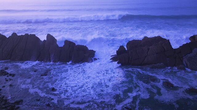 Aerial view of the sunset lights on the cliffs of Madero Beach in the Dunes of Liencres Natural Park. Pi&eacute;lagos Municipality, Costa Quebrada Geopark, Cantabrian Sea, Cantabria, Spain, Europe