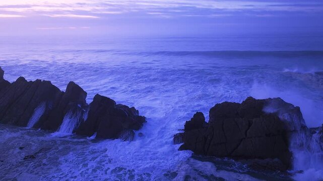 Aerial view of the sunset lights on the cliffs of Madero Beach in the Dunes of Liencres Natural Park. Pi&eacute;lagos Municipality, Costa Quebrada Geopark, Cantabrian Sea, Cantabria, Spain, Europe