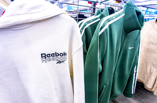 Reebok stylish sportswear. Branded Reebok t-shirt on a rack in a clothing store