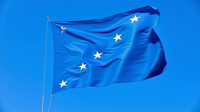 Micronesia flag waving in the wind against a clear blue sky background