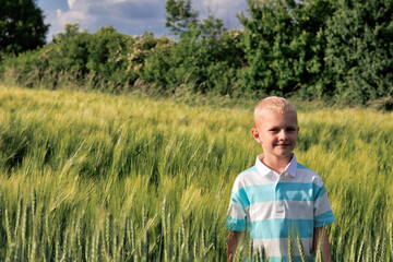 Boy in farmland during spring.