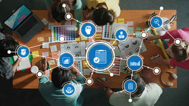 Creative Team Collaborating on Project with Color Charts and Digital Tools in Modern Workspace, Innovative Ideas and Strategies in View. Amity