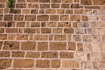 Stone wall background texture. Natural brown color blocks, horizontal and vertical pattern backdrop