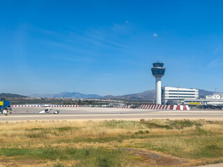 Athens Greece international airport. Air traffic control tower, terminal building and taxiways and runways