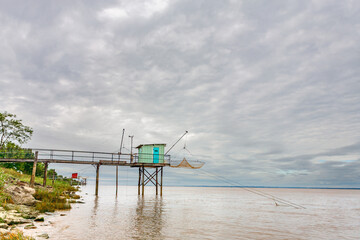 Fishing huts on stilts in Lamarque, Gironde estuary, inspired by Chinese fishing nets, called Carrelets in France, still popular in South West France by the Atlantic Ocean