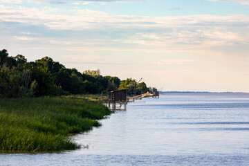 Fishing huts on stilts in Lamarque, Gironde estuary, inspired by Chinese fishing nets, called Carrelets in France, still popular in South West France by the Atlantic Ocean
