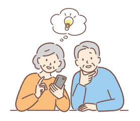 スマホの操作をする高齢者夫婦