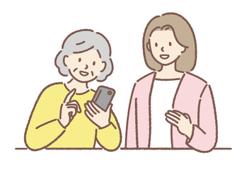 スマホ教室でスマホの操作を学ぶ女性シニア