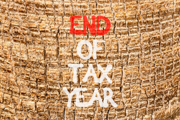 End of tax year symbol. Concept words phrase End of tax year on beautiful palm tree bark. Beautiful palm tree bark background. Business End of tax year concept. Copy space.