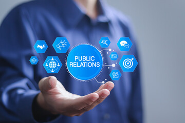 PR, Public relations concept. Communication advertising marketing strategy. Businessman holding...