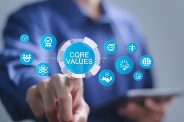Concept of core values for business. Businessman touching core values icons on virtual screen for...