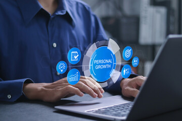 Fototapeta premium Personal growth concept. Creativity, vision, motivation, planning, develop, learning, training, and goals. Businessman using laptop with personal growth on virtual screen.