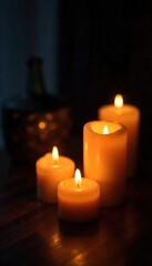 Warm candlelight illuminates a dark room, creating a cozy and inviting atmosphere Perfect for relaxation, meditation, or spiritual themes Multiple candles cast a soft glow , close-up, home