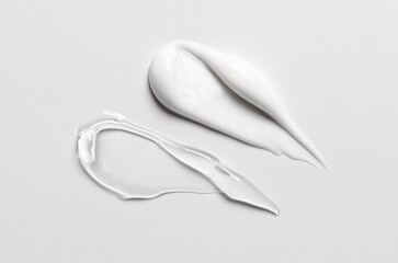 A sample of white and transparent cosmetic cream