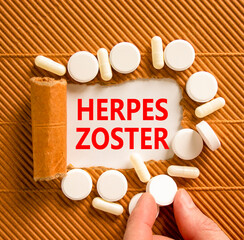 Herpes zoster symbol. Concept words Herpes zoster on beautiful white paper. White pills tablets....