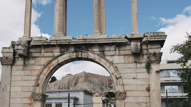Acropolis viewed through arch frame of Hadrian gate in Athens, Greece