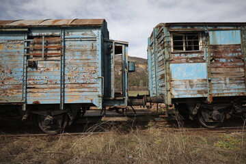 Abandoned old railway wagons at station, old train wagons in an abandoned station