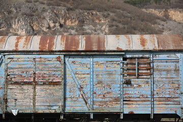 Abandoned old railway wagons at station, old train wagons in an abandoned station