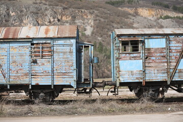 Abandoned old railway wagons at station, old train wagons in an abandoned station