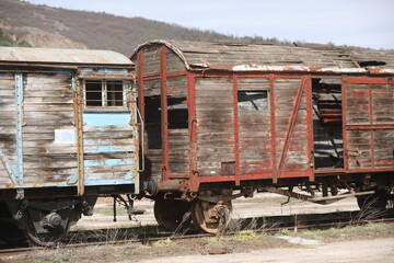 Abandoned old railway wagons at station, old train wagons in an abandoned station