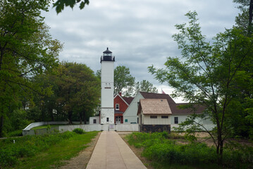 The old lighthouse and adjoining structures at Presque Isle State Park on Lake Erie in Pennsylvania under cloudy skies in late spring