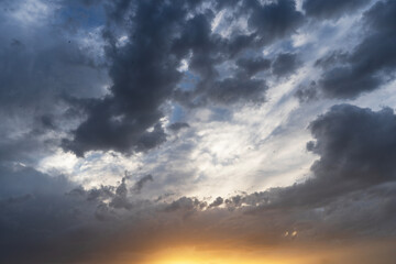 Beautiful bright sunset evening sky with dramatic clouds.