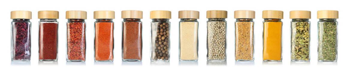 Different spices in glass jars on white background, set