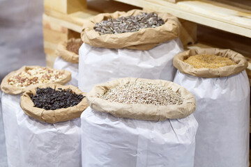 Variety of seeds in paper bags