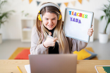 Teacher Tana is teaching online. She's using a whiteboard to help her students learn, making education accessible from home.
